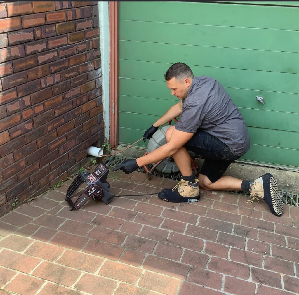Licensed plumber Luke from Plumd In Plumbing performing a drain camera inspection in the Northern Beaches