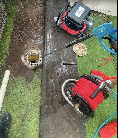 Sewer Services Northern Beaches Plumber using drain cleaning equipment to clear a blocked pipe